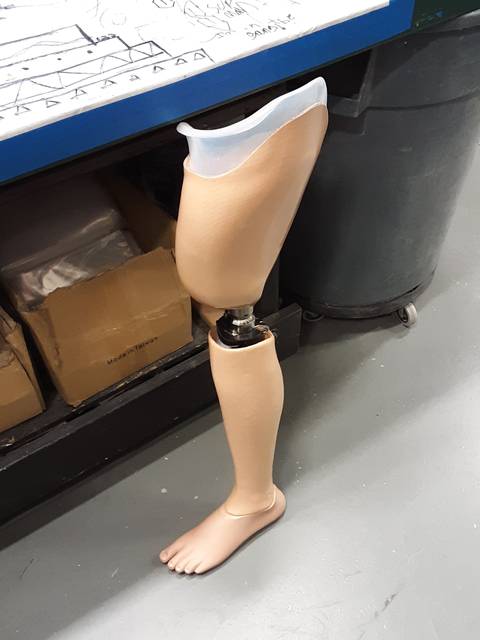 Finished prosthetic leg with cosmetic foot