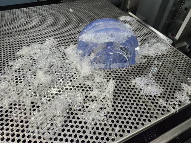 A part still wrapped in its support structure